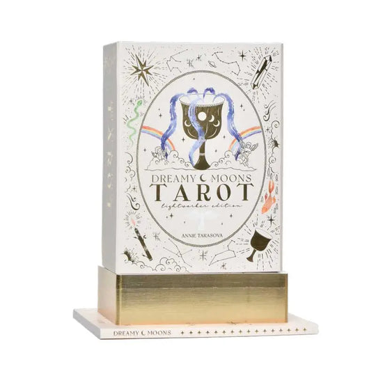 DECORATIVE GOLD FOIL ARTWORK DECORATES THE BOX AND GUIDEBOOK